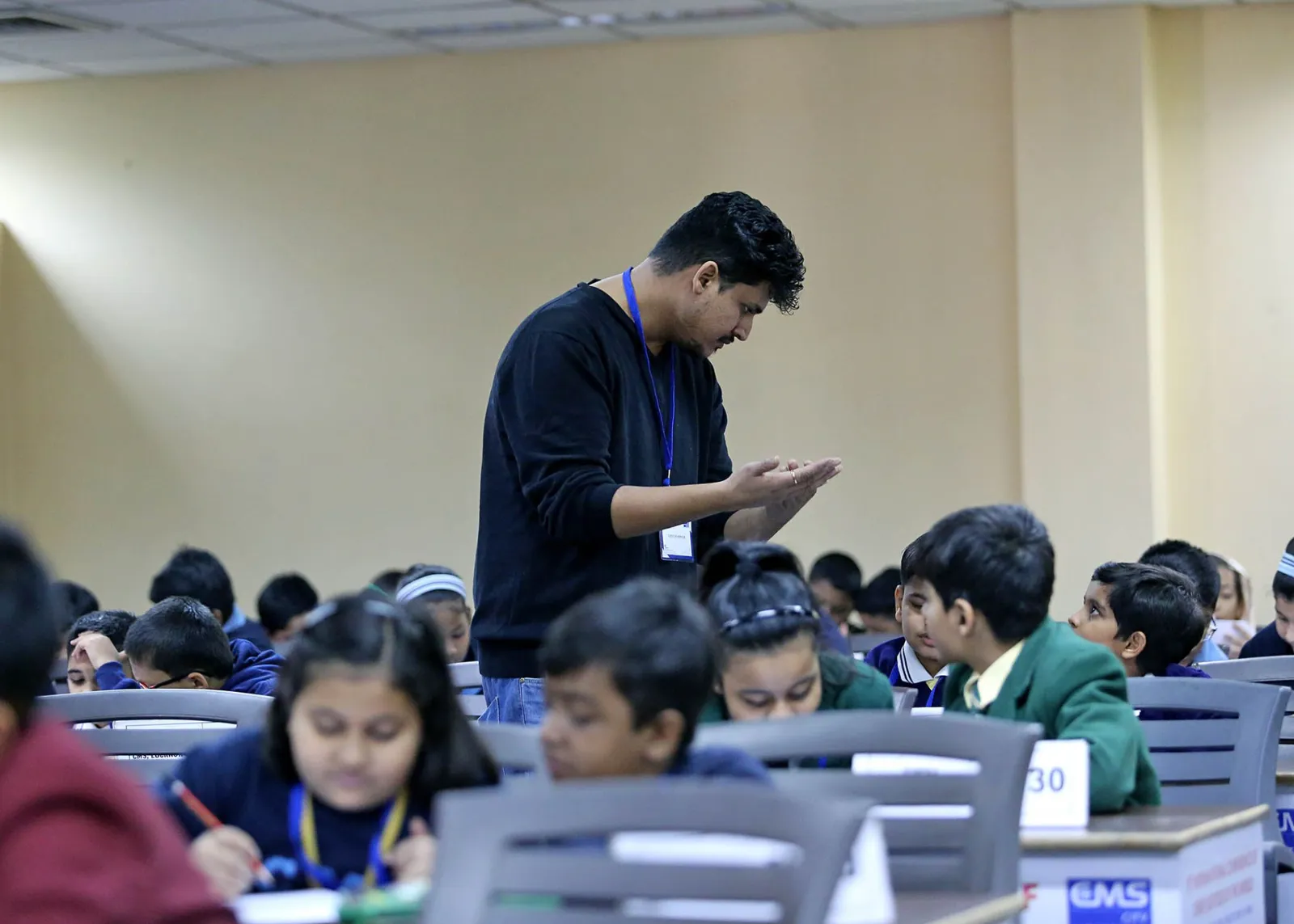 Tarush Jain, founder of Brainwiz, working with children during a session